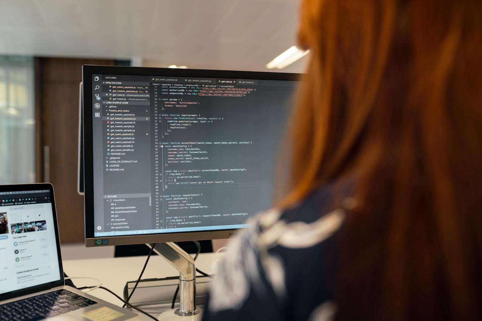 A Sytepoint engineer at work on application code