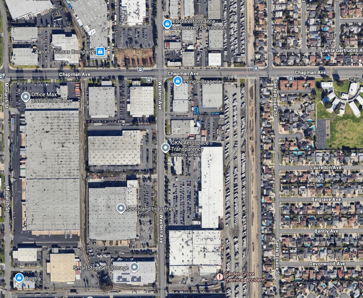 Close aerial view of the GKN Aerospace site next to the rail line, with residential streets including Santa Rosalia, Laurelton, and Belgrave just to the east.