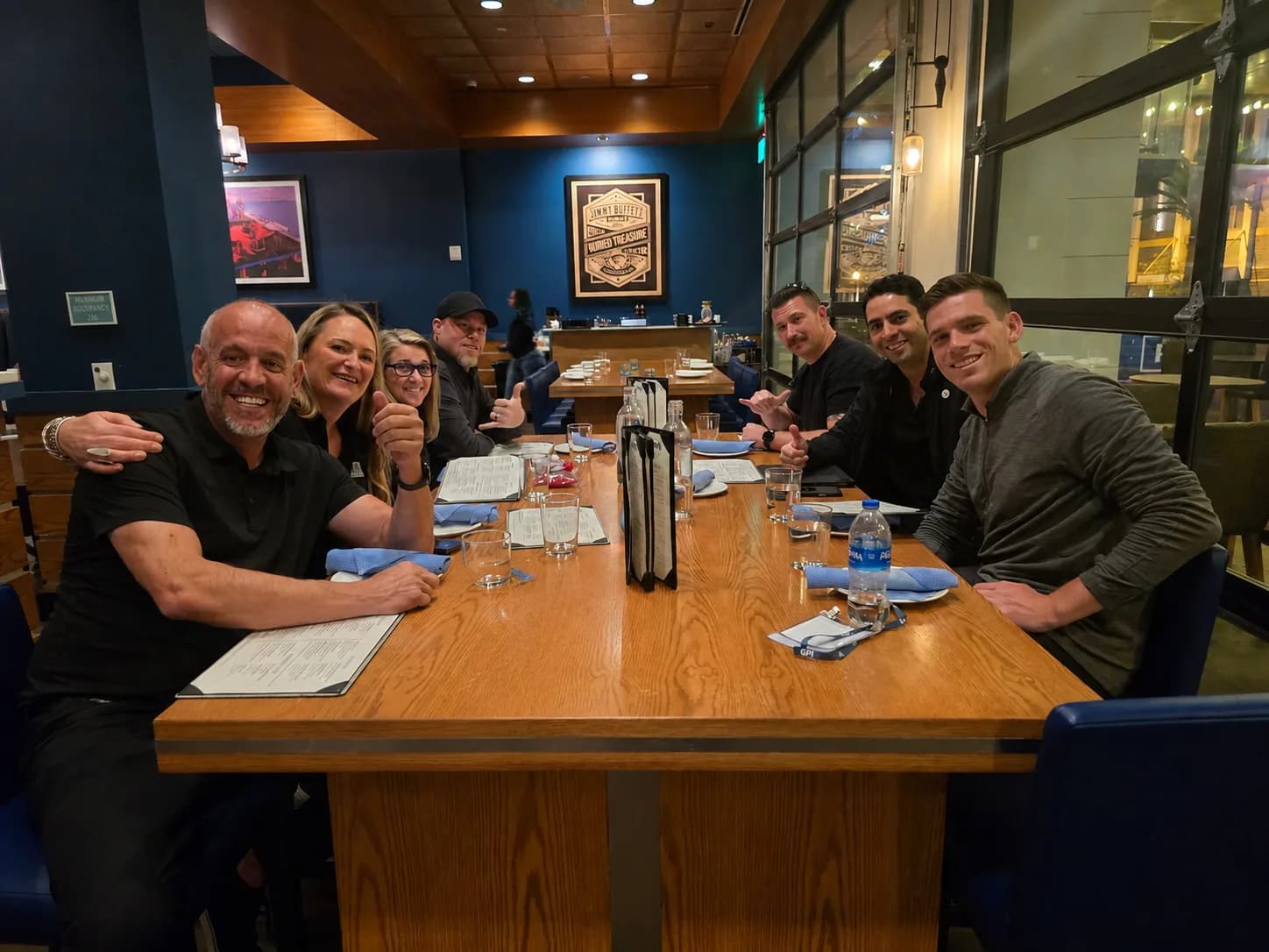 The Sytepoint team together over dinner during a trade-show trip