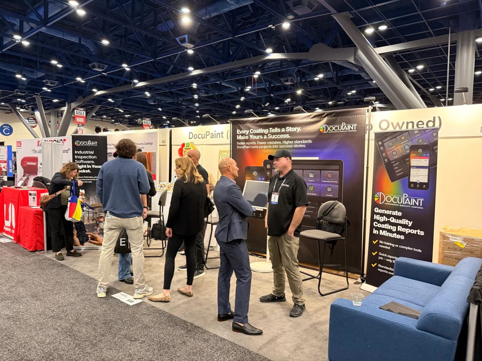 Steven Karapetyan talking through the software with attendees at the trade-show booth