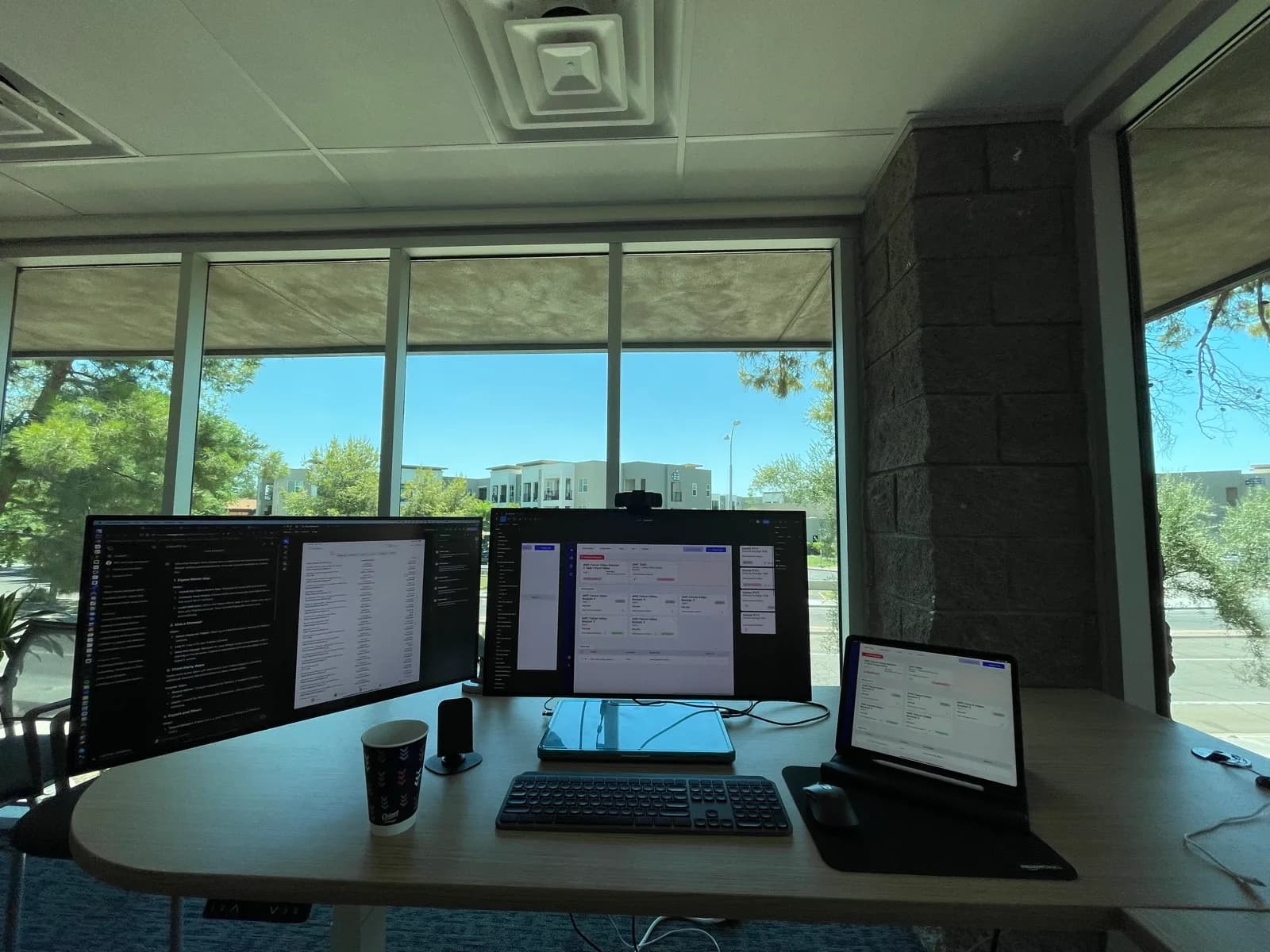 A Sytepoint engineering workstation with code and the platform running across two monitors